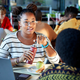 The image of students chatting in a cafeteria almost seems claustrophobic right now, doesn’t it?